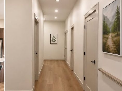 A wide, well-lit hallway with a handrail