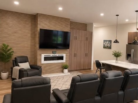 Open living room with recliners, fireplace, and adjoining kitchen